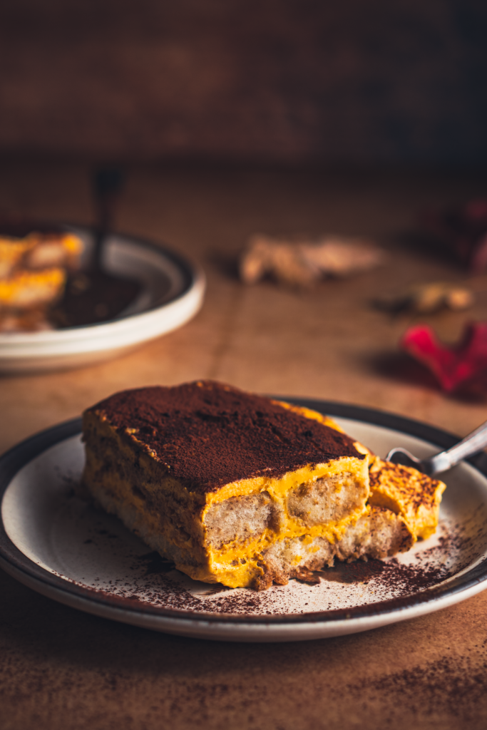 Pumpkin tiramisu dessert layered with mascarpone and cocoa