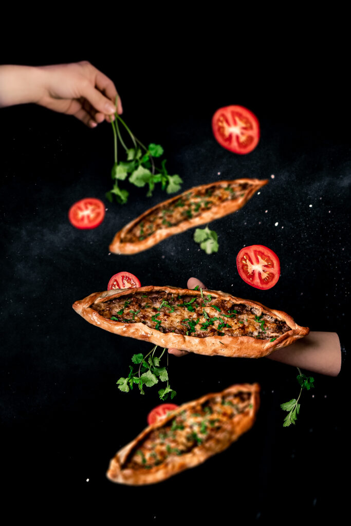 Boat-shaped Turkish pide flatbread with cheese filling