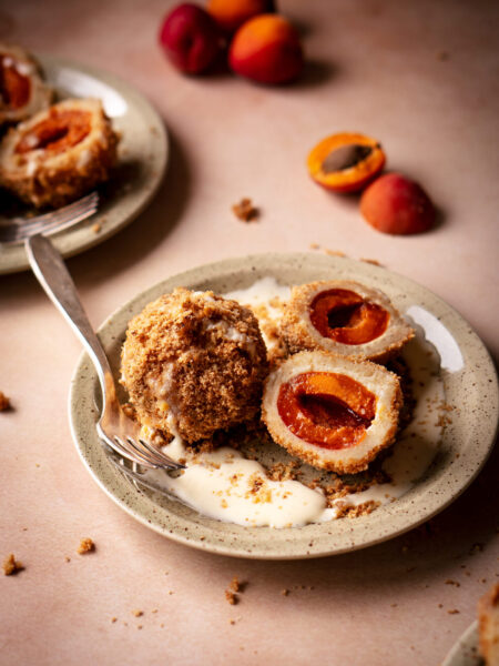 Traditional Austrian marillenknödel filled with apricots and rolled in breadcrumbs