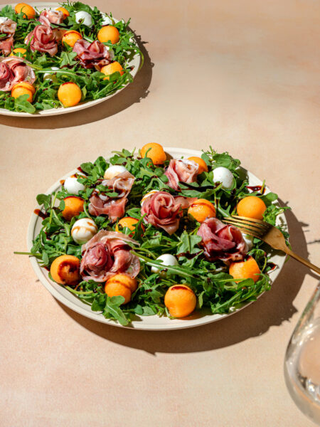 Italian prosciutto e melone salad with fresh cantaloupe, arugula, and sliced ham