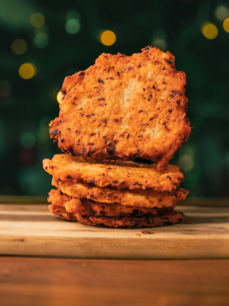 Crispy German potato pancakes served on a cutting board, traditional Reibekuchen recipe