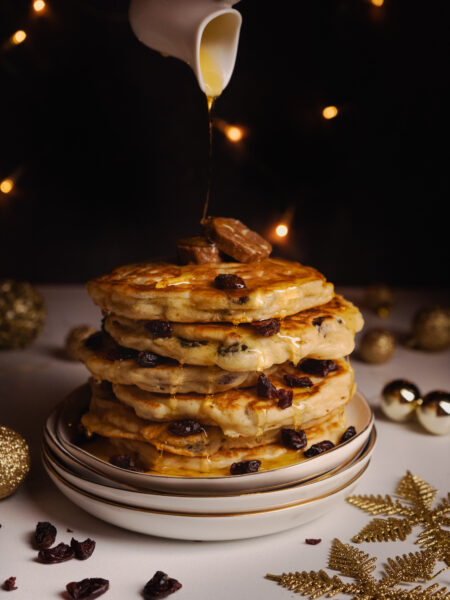 Holiday breakfast pancakes served with cinnamon butter and caramelized apples.