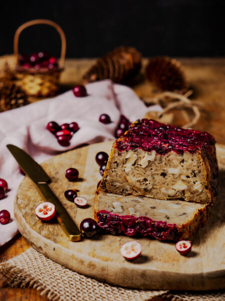 Vegetarian Christmas meatloaf made with mushrooms, nuts, and cranberries, perfect for a festive holiday dinner.